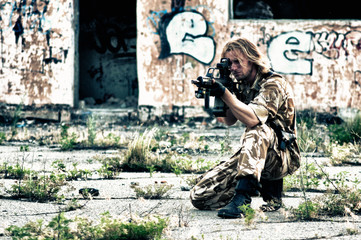 Fototapeta premium military with a rifle in his hands