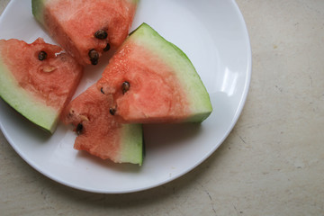 Pieces of watermelon on a white plate