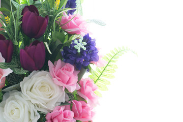 Beautiful colorful decoration artificial flower isolated on white background.