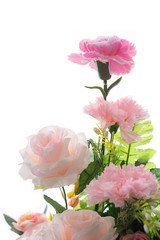 Obraz premium Beautiful colorful decoration artificial flower isolated on white background.