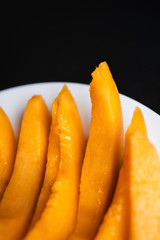 Fresh melons sliced on wooden table