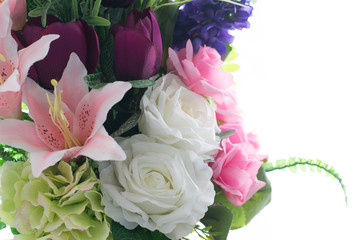 Beautiful colorful decoration artificial flower isolated on white background.