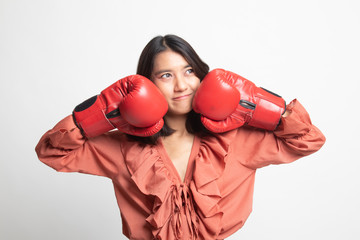 Young Asian woman with red boxing gloves .