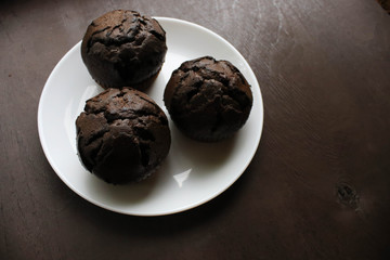 Chocolate cupcakes on a white plate