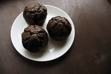 Chocolate cupcakes on a white plate