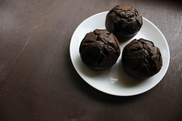Chocolate cupcakes on a white plate