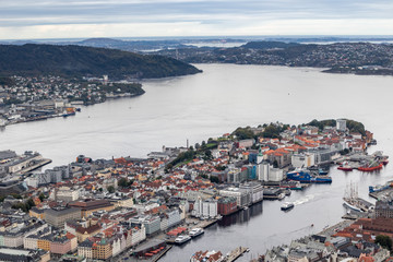 Fototapeta na wymiar Bergen city center and Northern sea panoramic aerial view from Floyfjellet observation deck on cloudy autumn day. Bergen, Norway 