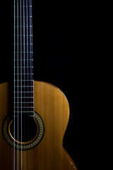 Fototapeta na wymiar classic spanish guitar on black background