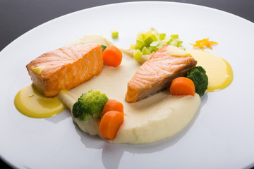 Fried salmon fillet with vegetables