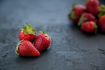 close-up strawberries on a dark background