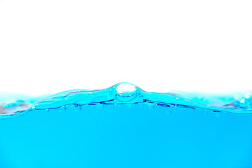 Clean blue water splash with bubbles of air on white background