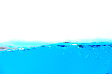 Clean blue water splash with bubbles of air on white background