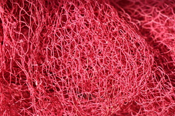 Fishing net which is red in color closeup shot