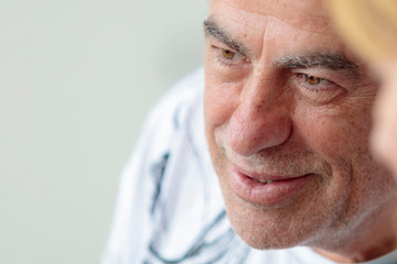 friendly grandfather smiling, big close, narrow focus