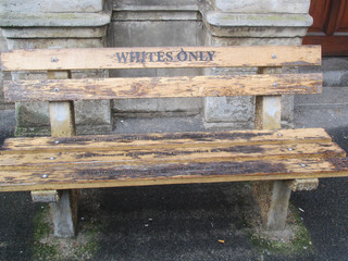 A bench in Cape Town during the apartheid period placed outside the High Court Civil Annex. Even benches were reserved to whites only of non white only - obrazy, fototapety, plakaty