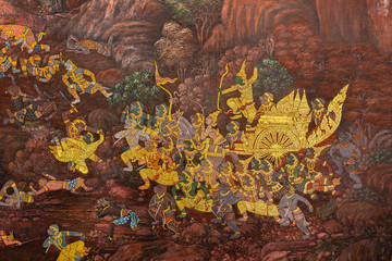 Gold color of old mural is the story of Ramakian ,Ancient fresco at Wat Phra Kaew temple in Bangkok, Thailand 