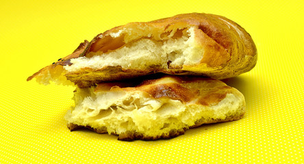 fresh baked bread isolated on yellow background