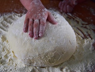 hands kneading dough