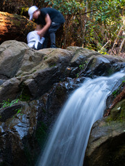 small waterfall in forest long exposure