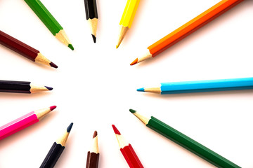 colored pencils on a white background