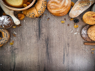 Fresh bakery, sliced bread on a wooden backround