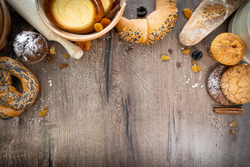 Fresh bakery, sliced bread on a wooden backround