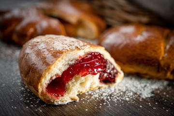 Fresh bakery, sliced bread on a wooden backround