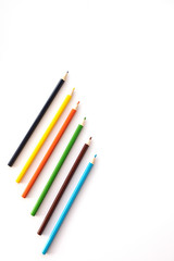 colored pencils on a white background