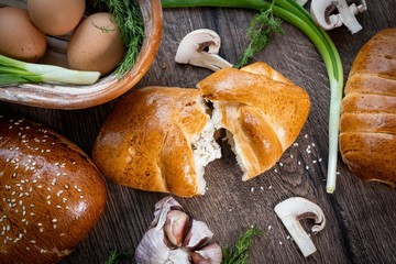 Fresh bakery, sliced bread on a wooden backround