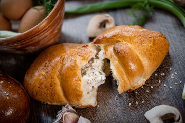 Fresh bakery, sliced bread on a wooden backround