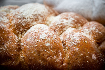 Fresh bakery, sliced bread on a wooden backround