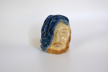 Hand made off the ceramic men's face with blue hair and blonde mustaches.