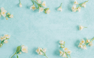 Fototapeta na wymiar Delicate pastel pattern with jasmine flowers. Flat lay. Top view