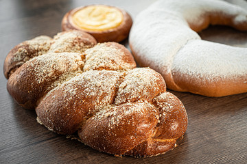 Fresh bakery, sliced bread on a wooden backround