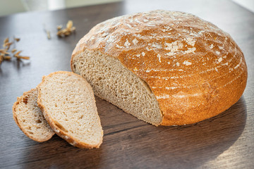 Fresh bakery, sliced bread on a wooden backround