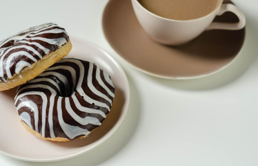 Doughnut with chocolate flavour filling, topped with white and black icing