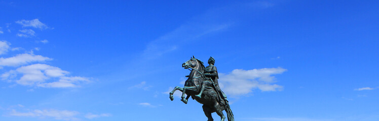 Fototapeta premium Bronze Horseman in Saint Petersburg, Russia. Equestrian statue outdoors on blue sky