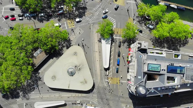 Aerial Drone Shot of Swiss Crossroad and Bellevue Tram Station Located in Z&uuml;rich -  Tilt Upwards
