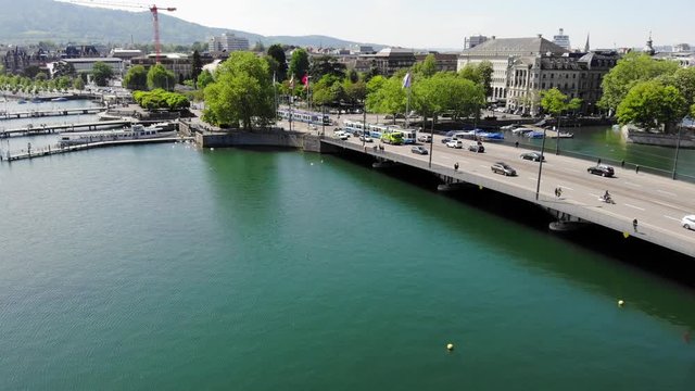 Aerial Drone Shot of Swiss Quai Bridge over Limmat River at City Lake - Moving Forward Shot