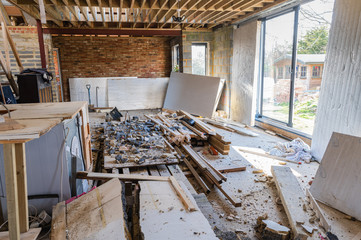 Demolition of the existing wall between the house and new extension. DIY renovation project, selective focus