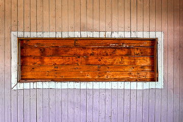 wooden niche in a weathered old wooden wall