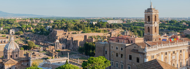 Fototapeta na wymiar Aetial view to the tower of the Campidoglio and ruins of Basilica Julia and Roman Forum, Rome, Italy.