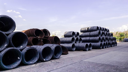 Stacked of high carbon wire rod for heavy industry production,Pile of metal steel wire roll for construction site, concrete usage and building construction