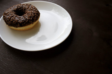 Chocolate donuts on a white plate