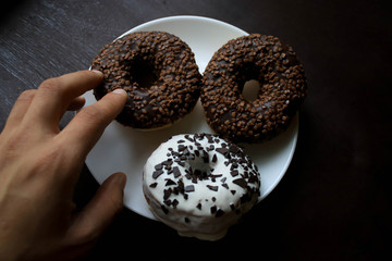 Chocolate donuts on a white plate