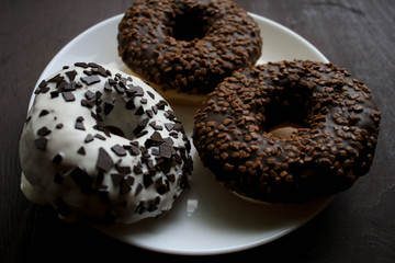 Chocolate donuts on a white plate