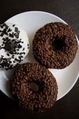 Chocolate donuts on a white plate