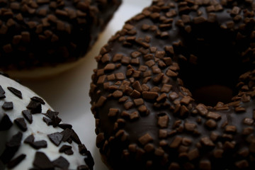 Chocolate donuts on a white plate
