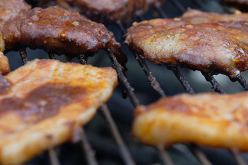 Grilled bacon on the barbecue. Food background selective focus.