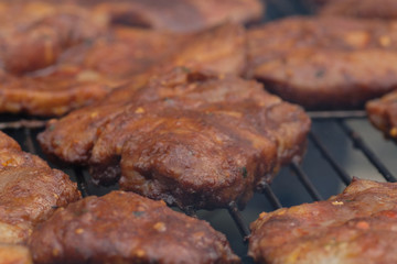 Grilled meat on the barbecue. Food background selective focus.
